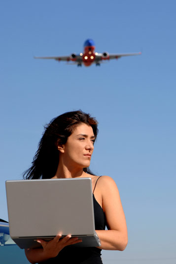 Image of a woman using Plane Fax Escrow and Title Services